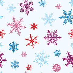 Christmas seamless pattern of complex big and small multicolored snowflakes on white background