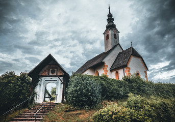 Fototapeta na wymiar Church of Maria Worth at Lake Woerthersee near Velden in Austria during Summer