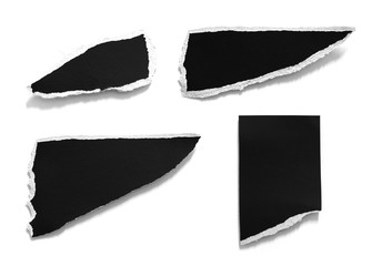 old torn black paper isolated on white background