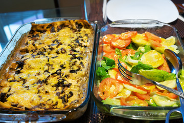 Vegetarian lasagna with mushrooms and salad