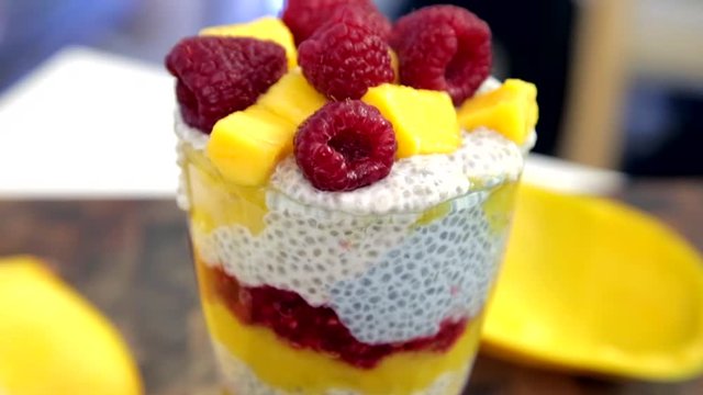 layered chia pudding glass with blue spirulina and coconut matcha, healthy but tasty food.
