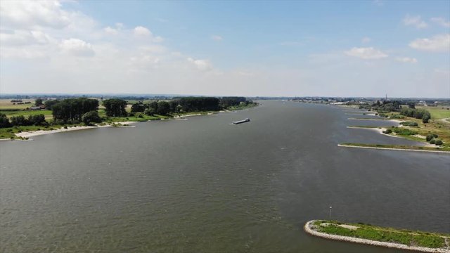 Cargo vessel on the River Rhine (Rijn) on the border of the Netherlands and Germany (facing the Netherlands)