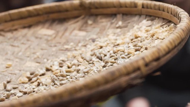 Coffee beans beeing siffed in slowmotion