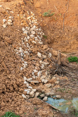 Concrete debris with soil, coastal canal.