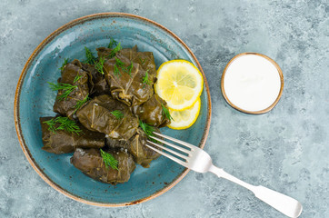 Dolma with meat, rice in grape leaves. 
