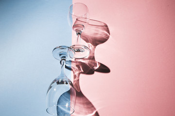 Creative Fun Colorful Pastel Pink And Blue Colors Abstract Design Background, Light And Wine Glass