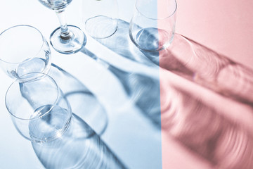 Creative Fun Colorful Pastel Pink And Blue Colors Abstract Design Background, Light And Wine Glass