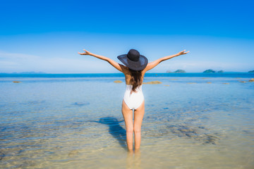 Portrait beautiful young asian woman looking sea beach ocean for relax in holiday vacation travel