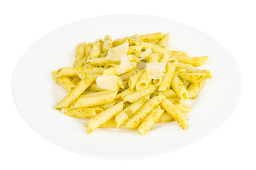White plate with pasta and pesto
