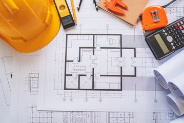 Top view of architectural blueprints on the worktable.