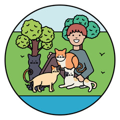 young man with cute cats mascots on the park