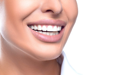 Teeth whitening concept - close up photo of a smiling woman.