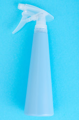 Blue bottle spray on bright background