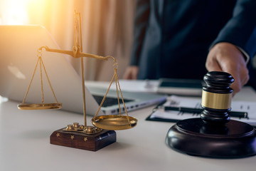 scales of justice and gavel on white background