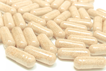 Medicine pills or capsules on white background