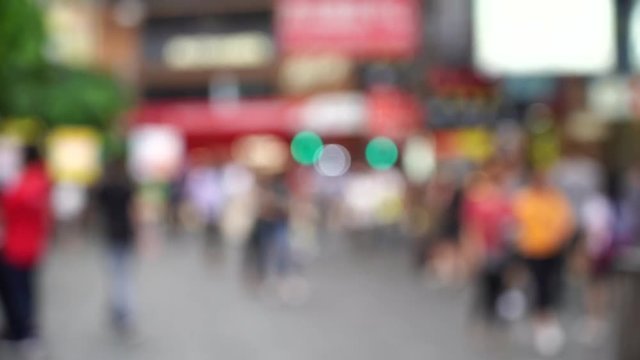 Blurred crowd of people on Hong Kong busy crosswalk; Slow Motion