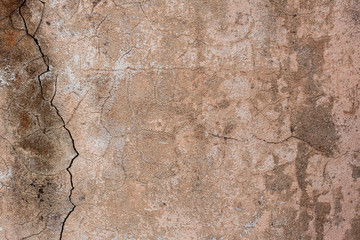 Texture of a concrete wall with cracks and scratches which can be used as a background