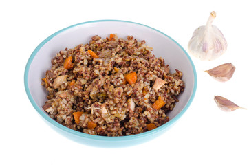 Red rice porridge with meat and vegetables.