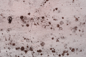 Texture of a concrete wall with cracks and scratches which can be used as a background