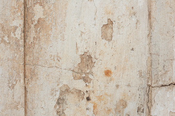 Texture of a concrete wall with cracks and scratches which can be used as a background