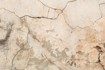 Texture of a concrete wall with cracks and scratches which can be used as a background