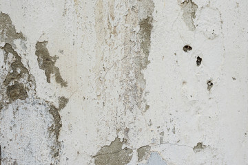 Texture of a concrete wall with cracks and scratches which can be used as a background
