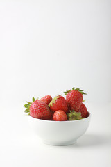 a bowl of strawbery isolated on white background