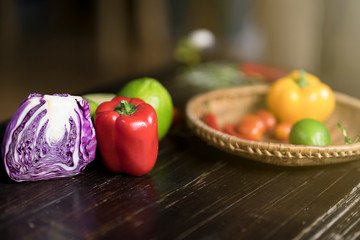 Colorful of Healthy fruit on wooden table. Chili , lemon, tomato, bell pepper, orange, cabbage, Multi fresh fruits on background. Studio photoshoot. Royalty high quality free stock image