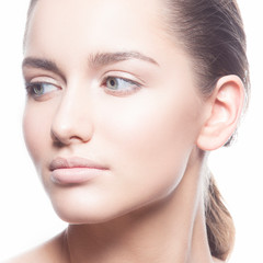 Fototapeta premium Close-up bauty face of young pretty model woman with makeup, blue eyes, healthy skin