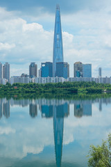 Fototapeta premium Lotte World Tower and cityscape with clear blue sky.