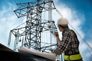 Electrical engineer control wiring electric power on steel tower,  Electric construction and...