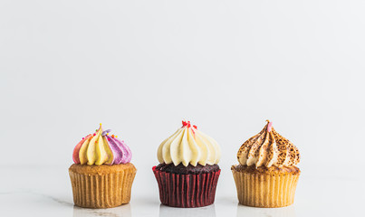 Variety Cupcakes with candle Birthday party background ,cupcake on white background 