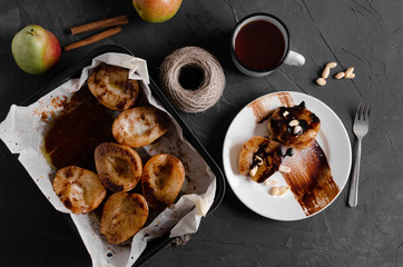 Caramelized Pears - Poached pears with spices in syrup on the white plate