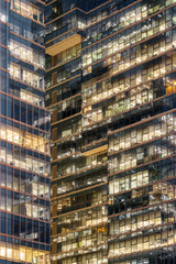 Fototapeta na wymiar Amazing glowing windows of skyscrapers. Modern office buildings