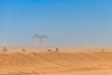 Safari trip through egyptian desert driving ATV. Quad bikes safari in the desert near Hurghada, Egypt