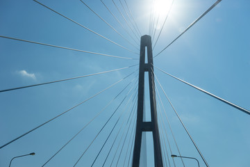 Details of the Russian bridge on the background of the blue sky in the backlight.