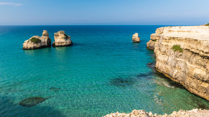 Dreamlike Salento. Bay of Torre dell'Orso and stacks of the two sisters. Puglia, Italy