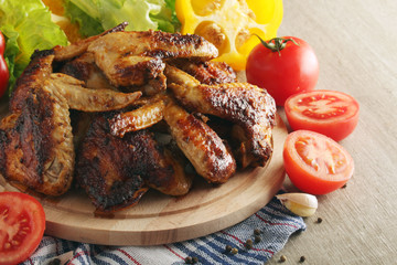 Chicken wings barbecue with different vegetables	