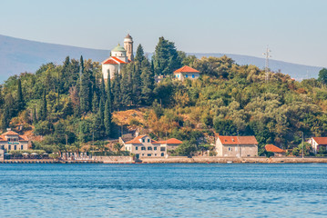 View of the ancient Temple of the Covering of the Blessed Virgin on the coast of Kotor Bay, Tivat,...