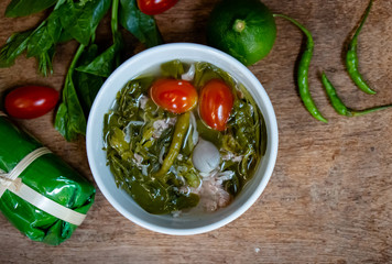 Hot, sour and spicy Basella alba or Ceylon Spinach leaf with fermented sausage soup. Northern Thai food with high vitamin vegetable.