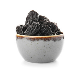 Bowl with tasty prunes on white background