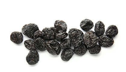 Tasty prunes on white background