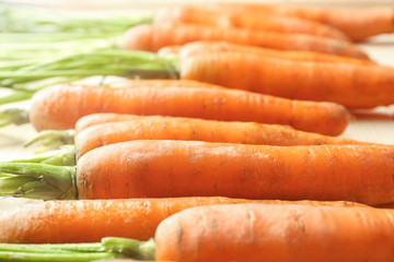 Tasty fresh carrot on table, closeup