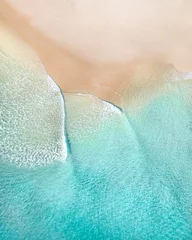  Aerial of a beach with beautiful waves, white sand and ocean textures © FRPhotos