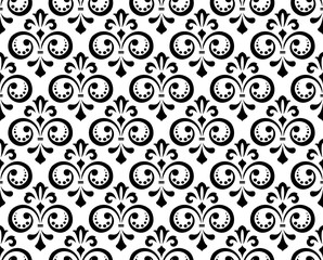 Floral pattern. Vintage wallpaper in the Baroque style. Seamless vector background. White and black ornament for fabric, wallpaper, packaging. Ornate Damask flower ornament