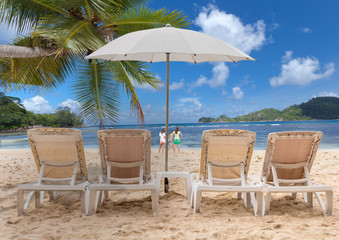 chairs and umbrella on the beach, Seychelles 