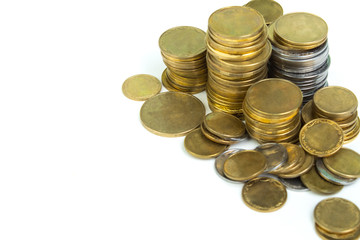 Gold towers made out of gold and silvery coins, stack isolated on white.
