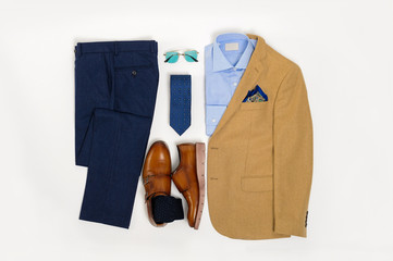 Men's casual outfits for man clothing set wit suit, sunglasses, trousers, socks, shirt, and shoes isolated on white background, Top view. pack shot © PicProduction