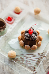 Christmas Tiramisu with biscuits, blackberries and cherry on top