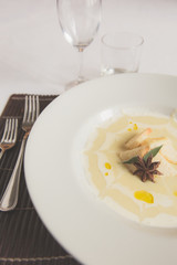 Smashed Potatoes in white plate and star anice